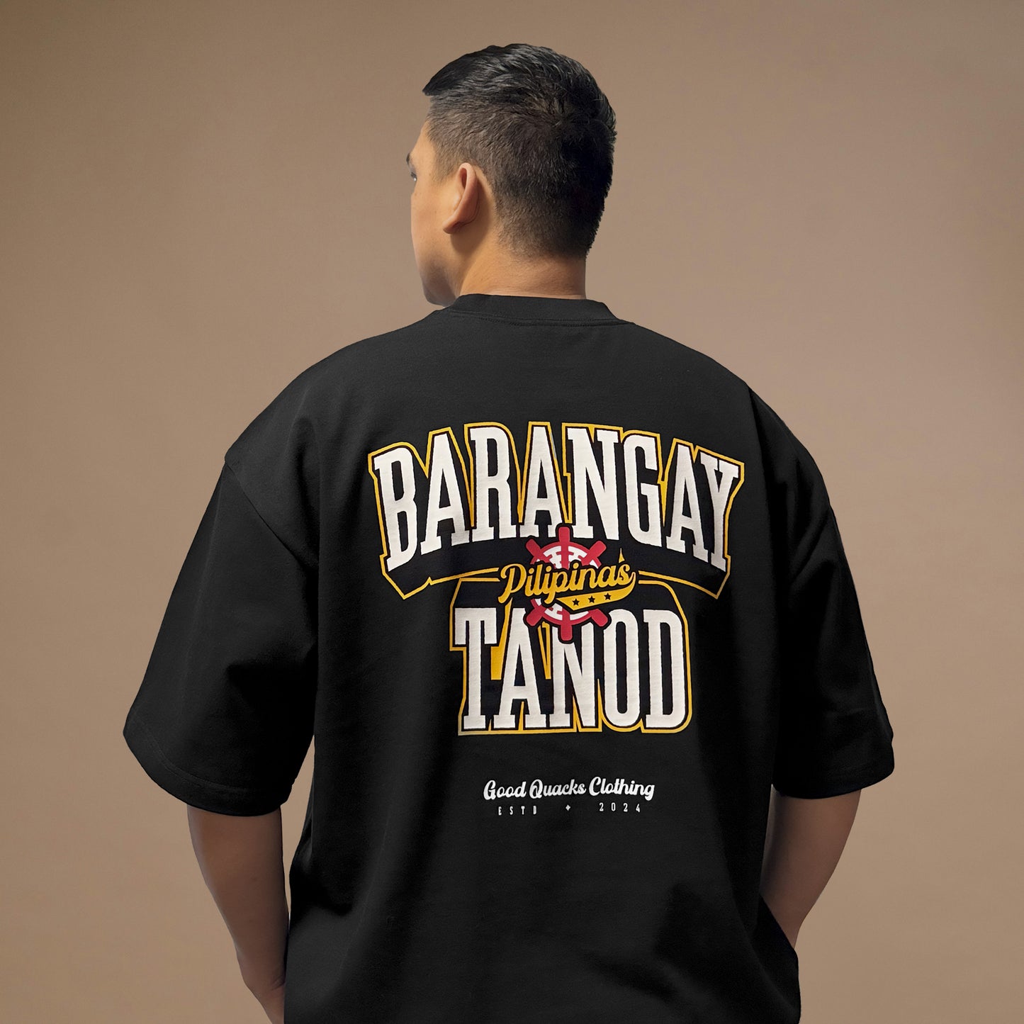 Model wearing oversized Barangay Tanod shirt back view, celebrating Pinoy Pride with a stylish cultural touch.